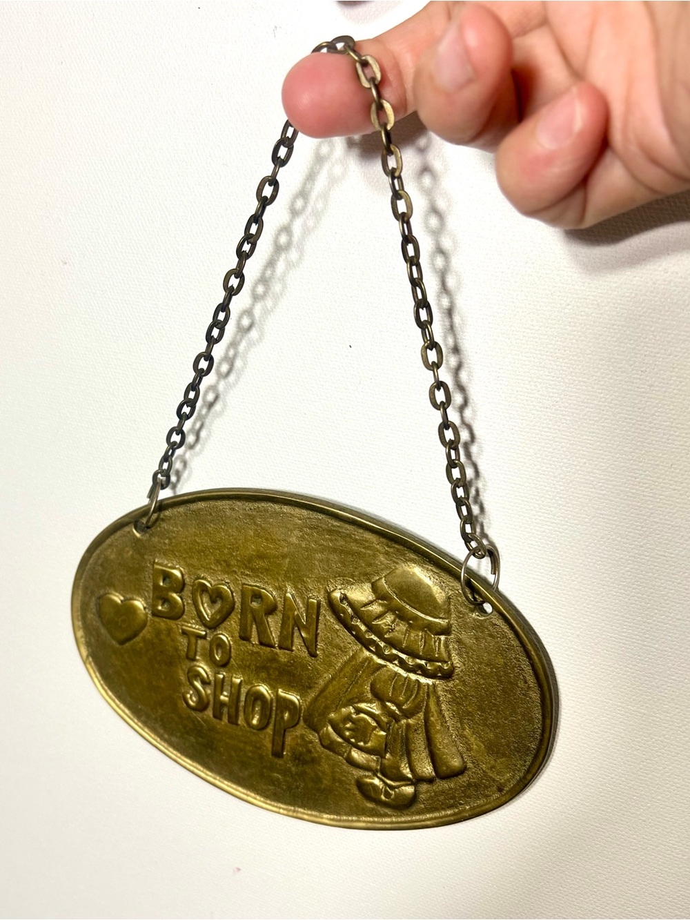 Vintage “Born to Shop” Brass Hanging Sign 1986 Kitsch Hollie Hobby Plaque
